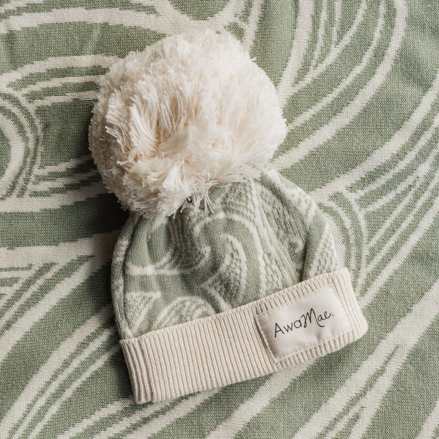 Te aroha o te mātua - The love of a parent- Knitted pēpi blanket- sage green - AwaMae