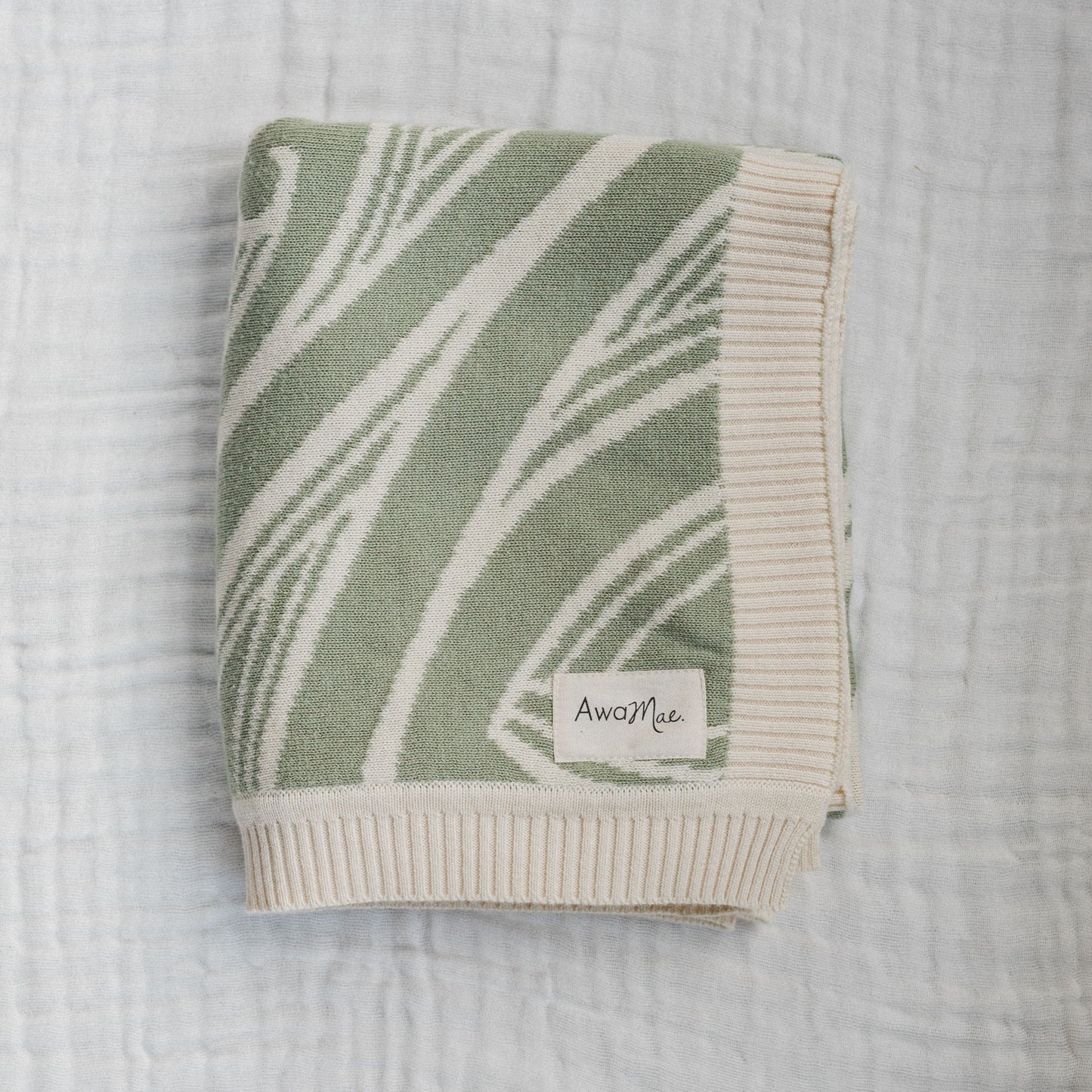 Te aroha o te mātua - The love of a parent- Knitted pēpi blanket- sage green - AwaMae