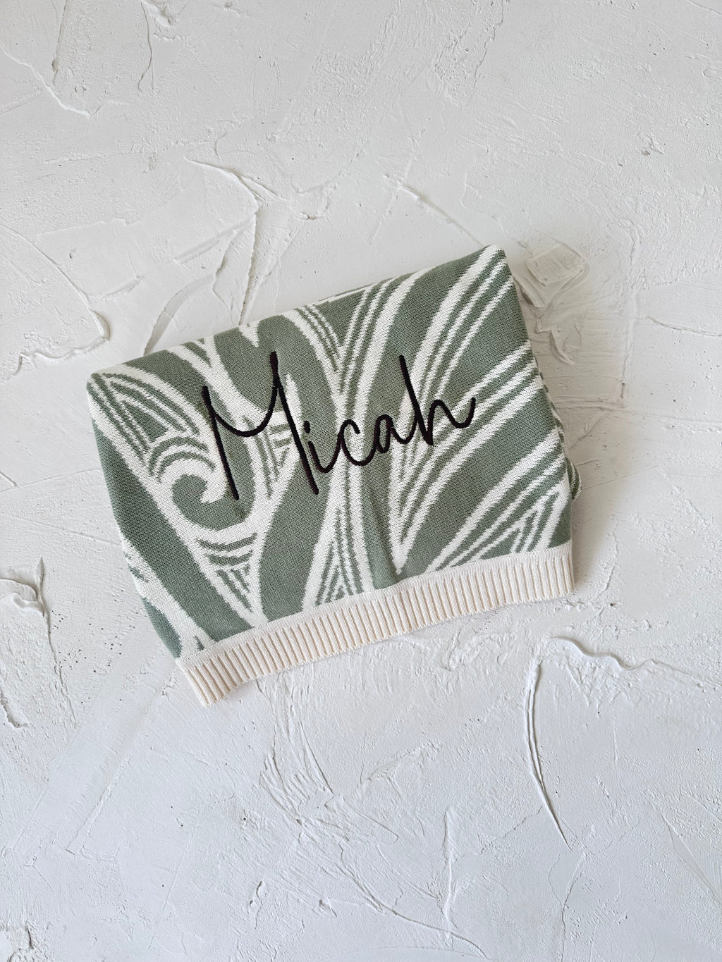 PREORDER Te aroha o te mātua - The love of a parent- Knitted pēpi blanket- sage green PREORDER
