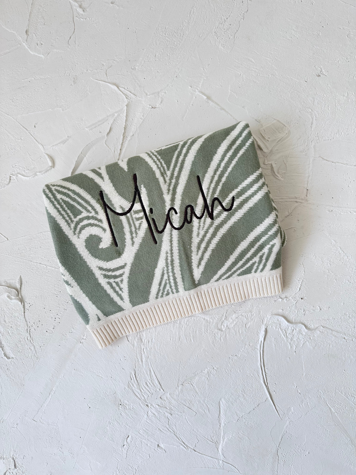 PREORDER Te aroha o te mātua - The love of a parent- Knitted pēpi blanket- sage green PREORDER