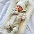 The wolf Sherpa hooded romper - Pebble.