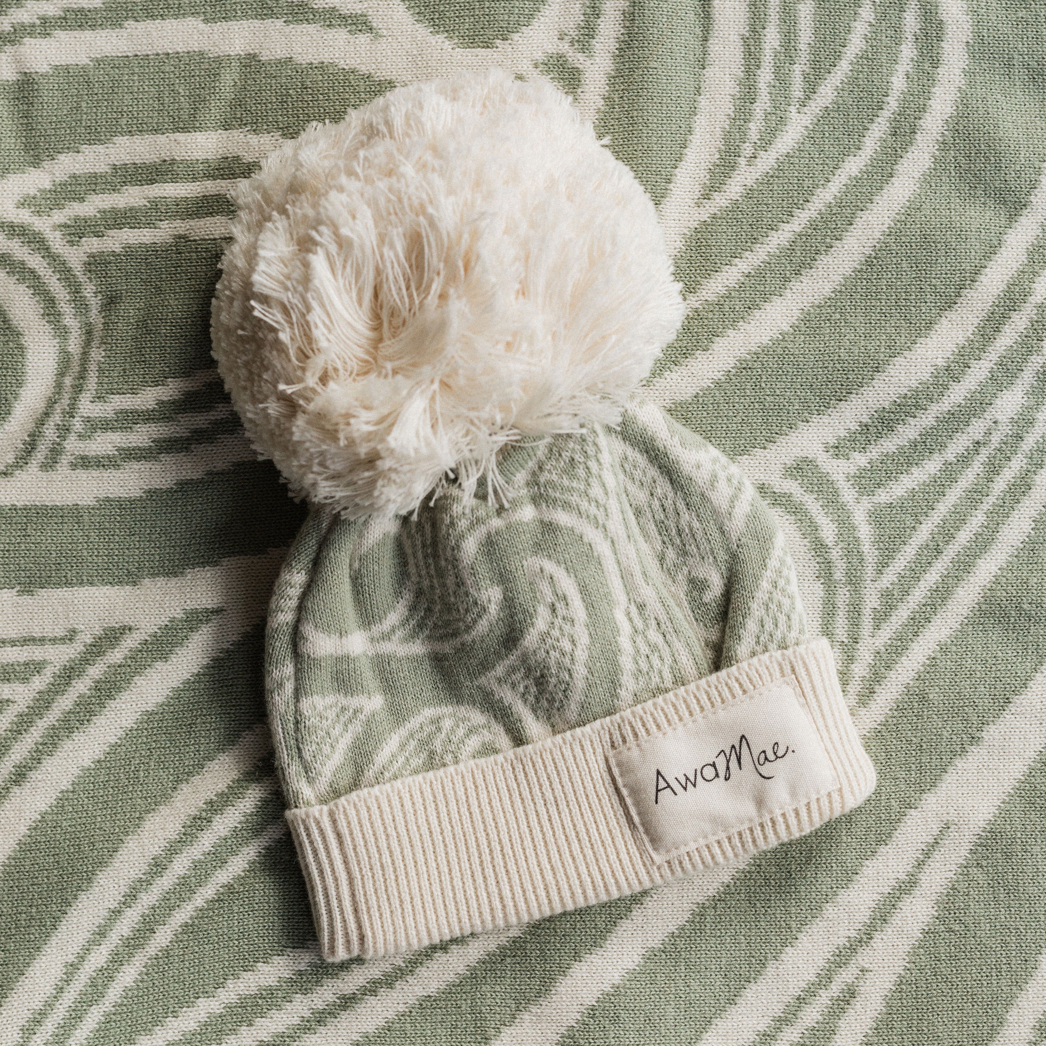 Te aroha o te mātua - The love of a parent- Knitted pēpi blanket- sage green - AwaMae